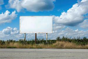 Large blank billboard showing an empty white screen on countryside road photo