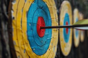 Archery arrow hitting the center of target during competition photo