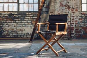Classic director's chair sitting in an empty room with exposed brick photo