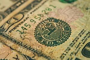 Close up of the seal of the federal reserve system on a ten dollar bill showing concept of finances photo
