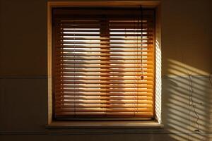 Sunlight shining through window blinds casting shadows on wall photo