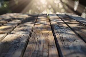 Warm sunlight filters through leaves, casting a soft glow on a rustic wooden table photo