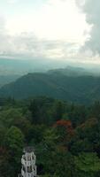 View of green mountains from ancient tower. Action. Beautiful view of green mountains from historic tower. Tourist observation deck from ancient tower in green mountains video