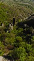 Extreme flight between mountain rocks. Shot. Fast flight at rocky formations on mountain slopes. Fly like wingsuit on rocky slopes of green mountains video