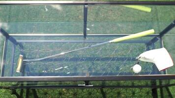 A Comprehensive Golf Practice Setup Featuring Various Accessories on Display for Use video