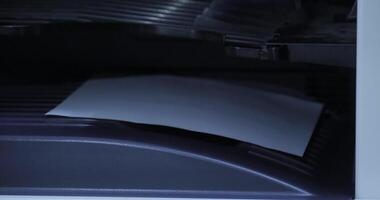A shows a papers journey through printing and scanning video