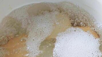 eggs are boiling in white casserole video