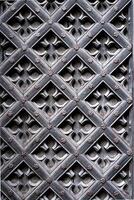 a close up of a decorative pattern of a wooden door. photo