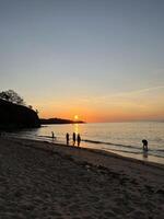 a very beautiful sunset view on the shores of Teluk Gurita Beach photo