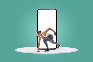 A fit person is in an athletic pose, seemingly emerging from a large smartphone on a bright and cheerful backdrop, conveying a sense of energy and dynamism. photo