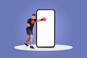 A person wearing boxing gloves is practicing punches in front of a large blank mobile phone. The background is a solid, vibrant color, creating a dynamic atmosphere for fitness activities. photo