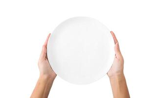 Hunger concept. Woman holding empty plate waiting for food, isolated on white background, top view, copy space photo
