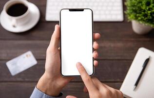 Man touching blank smartphone screen at workplace, mockup for application ar website, free space photo