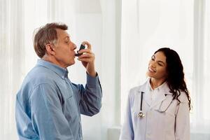 Medical Advice. Elderly man using asthma inhaler, mexican doctor watching, free space photo