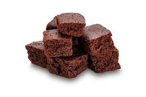 Pile of sweet crispy brownie chocolate cube isolated on white background with clipping path. photo