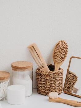Bath background front view with straw box, container with toothbrushes, cosmetics photo