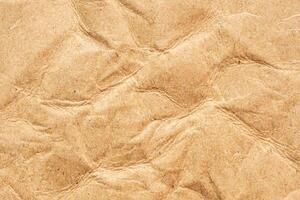 Abstract crumpled and creased recycle brown paper texture background photo