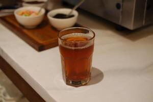 hot tea in glass on table. Selective focus and shallow depth of field. photo