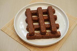 Chocolate wafers on a white plate, close-up photo