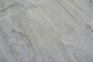Close-up Texture of Sandy Surface photo