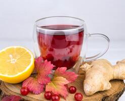 Viburnum tea with lemon and ginger. Alternative medicine. Close-up. Selective focus. photo
