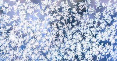 Beautiful frosty pattern on the window. Ice natural pattern. Texture. Selective focus. photo