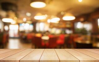Empty wooden table top with lights bokeh on blur restaurant background. photo