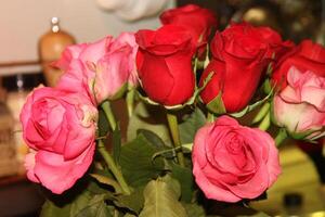 Bouquet Of Red And Pink Roses In A Vase. photo
