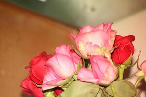 Bouquet Of Red And Pink Roses In A Vase. photo