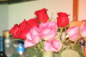 Bouquet Of Red And Pink Roses In A Vase. photo