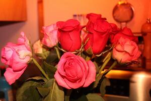 Bouquet Of Red And Pink Roses In A Vase. photo
