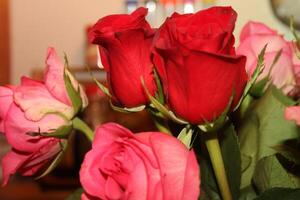 Bouquet Of Red And Pink Roses In A Vase. photo