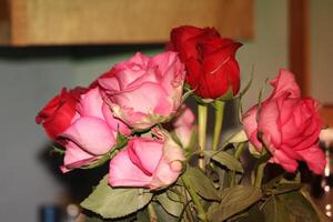 Bouquet Of Red And Pink Roses In A Vase. photo