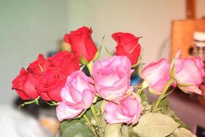 Bouquet Of Red And Pink Roses In A Vase. photo
