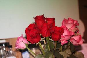 Bouquet Of Red And Pink Roses In A Vase. photo