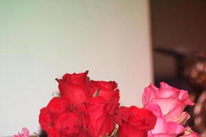 Bouquet Of Red And Pink Roses In A Vase. photo