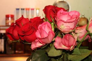 Bouquet Of Red And Pink Roses In A Vase. photo