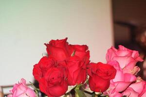 Bouquet Of Red And Pink Roses In A Vase. photo