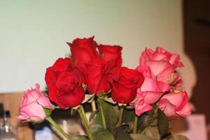 Bouquet Of Red And Pink Roses In A Vase. photo