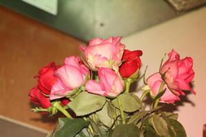 Bouquet Of Red And Pink Roses In A Vase. photo