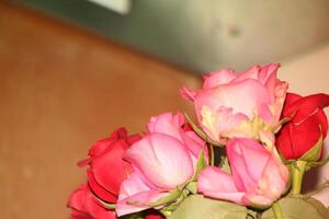 Bouquet Of Red And Pink Roses In A Vase. photo