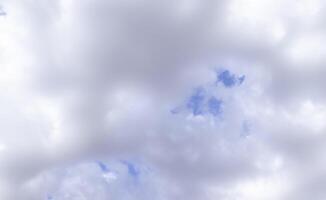 Overcast sky with dark clouds. Dark sky before a thunder-storm. The gray cloud background before rain. photo