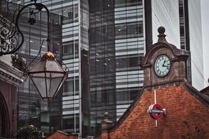 Modern Skyscraper, Brick Building, and Lantern in Hammersmith, London photo