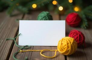 Cozy Christmas card with colorful yarn balls and festive lights on wooden table photo