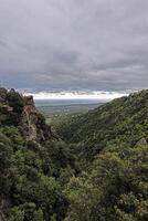 Panoramic view of Corsicas eastern coastline captured from the mountainous inland with lush greenery photo