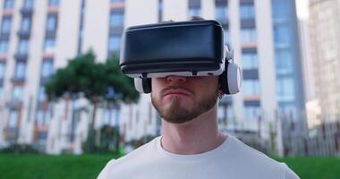 A man wearing a virtual reality headset video