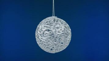 A white egg shaped ornament hanging from a string video