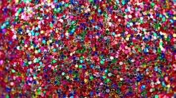 A close up of a colorful glittery background video