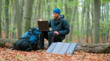 A man with a laptop in the woods video