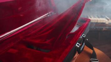 A red suitcase with a red cloth on top video
